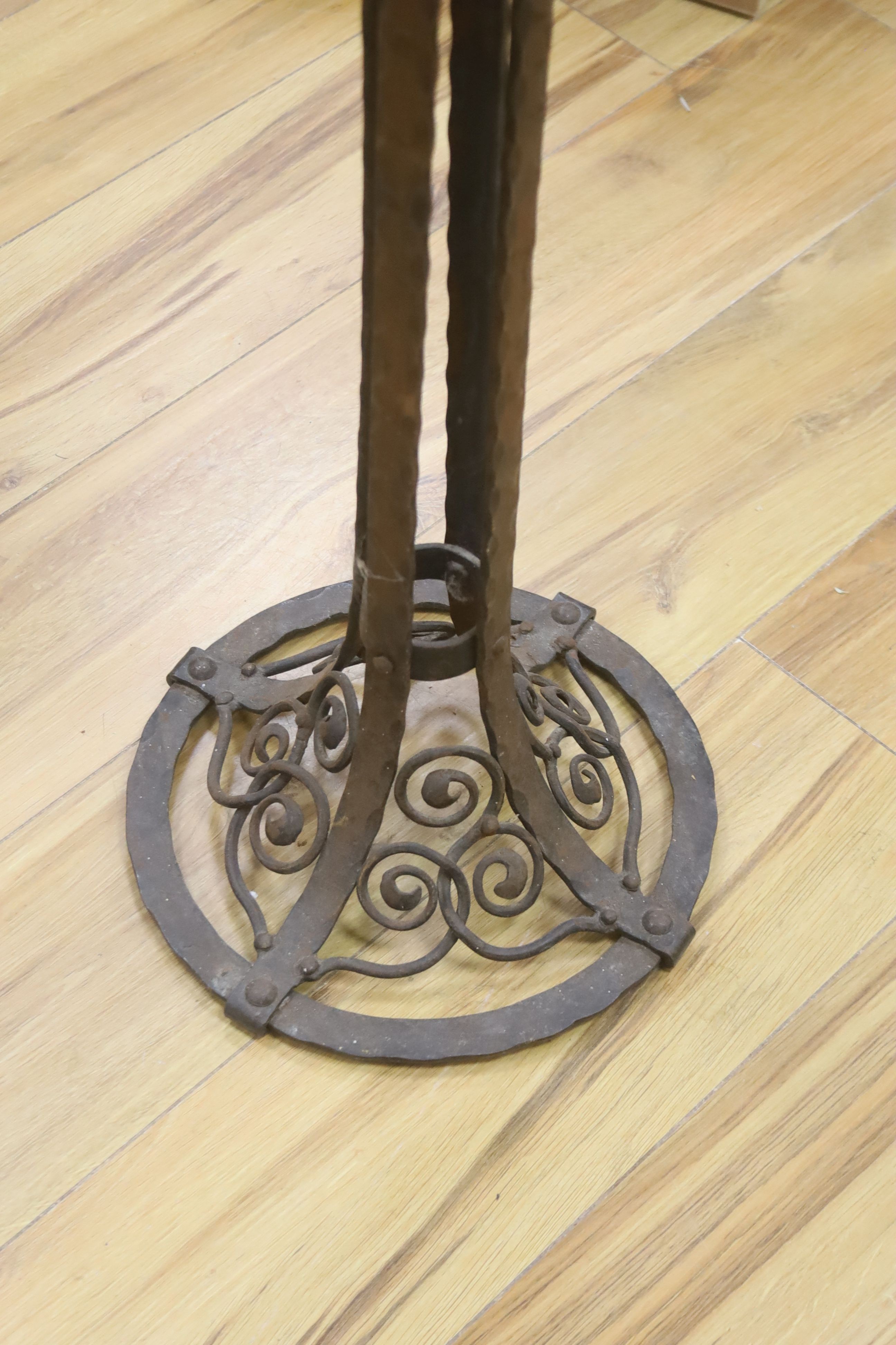 In the Manner of Edgar Brandt. A wrought iron circular smoker's companion